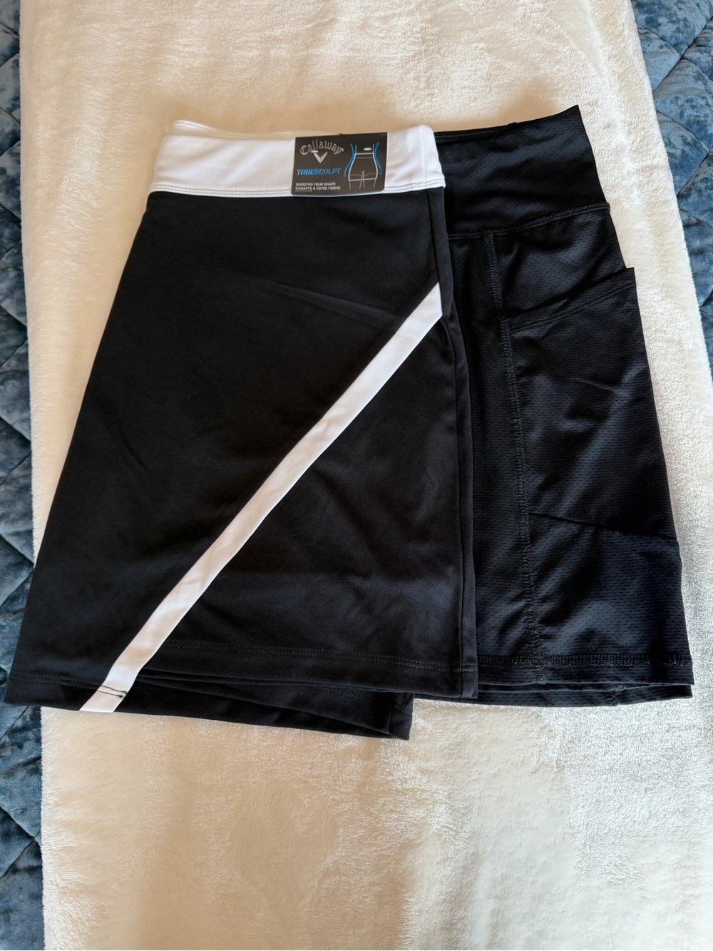 Lot of two skorts, Callaway B/W Golf Skort and solid black skort. Size -L